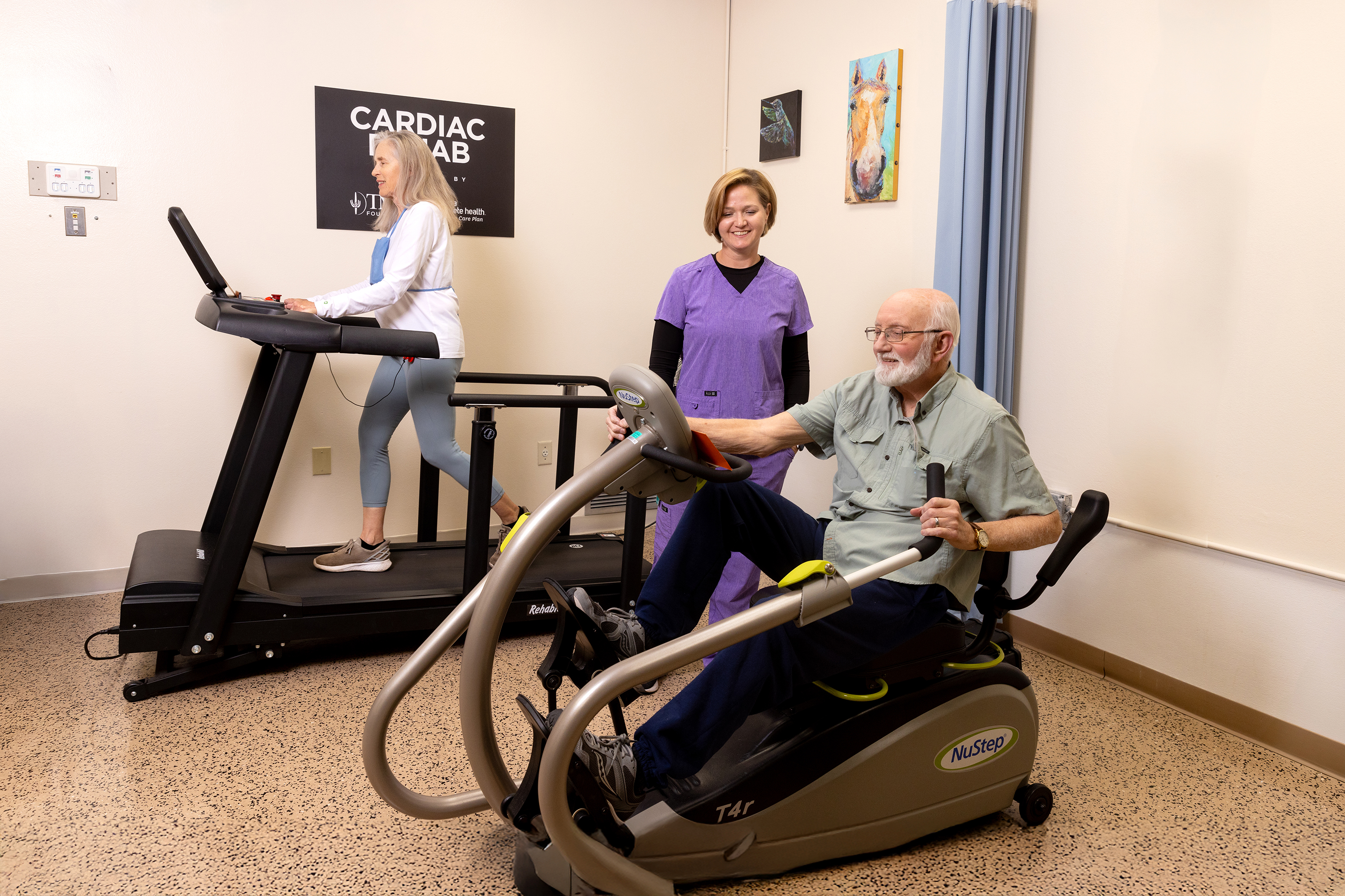 Patients work out on cardio machines at Benson Hospital's Cardiac Rehab program
